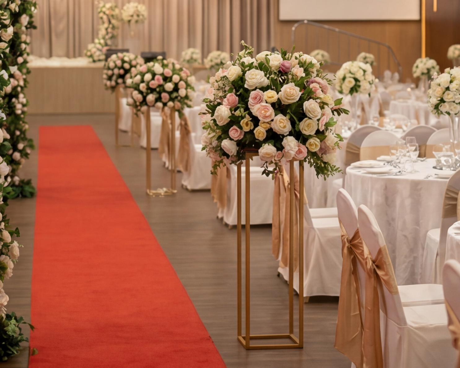 Floral aisle decoration beside red carpet